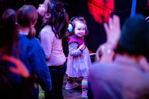 Toddler dancing at a gig